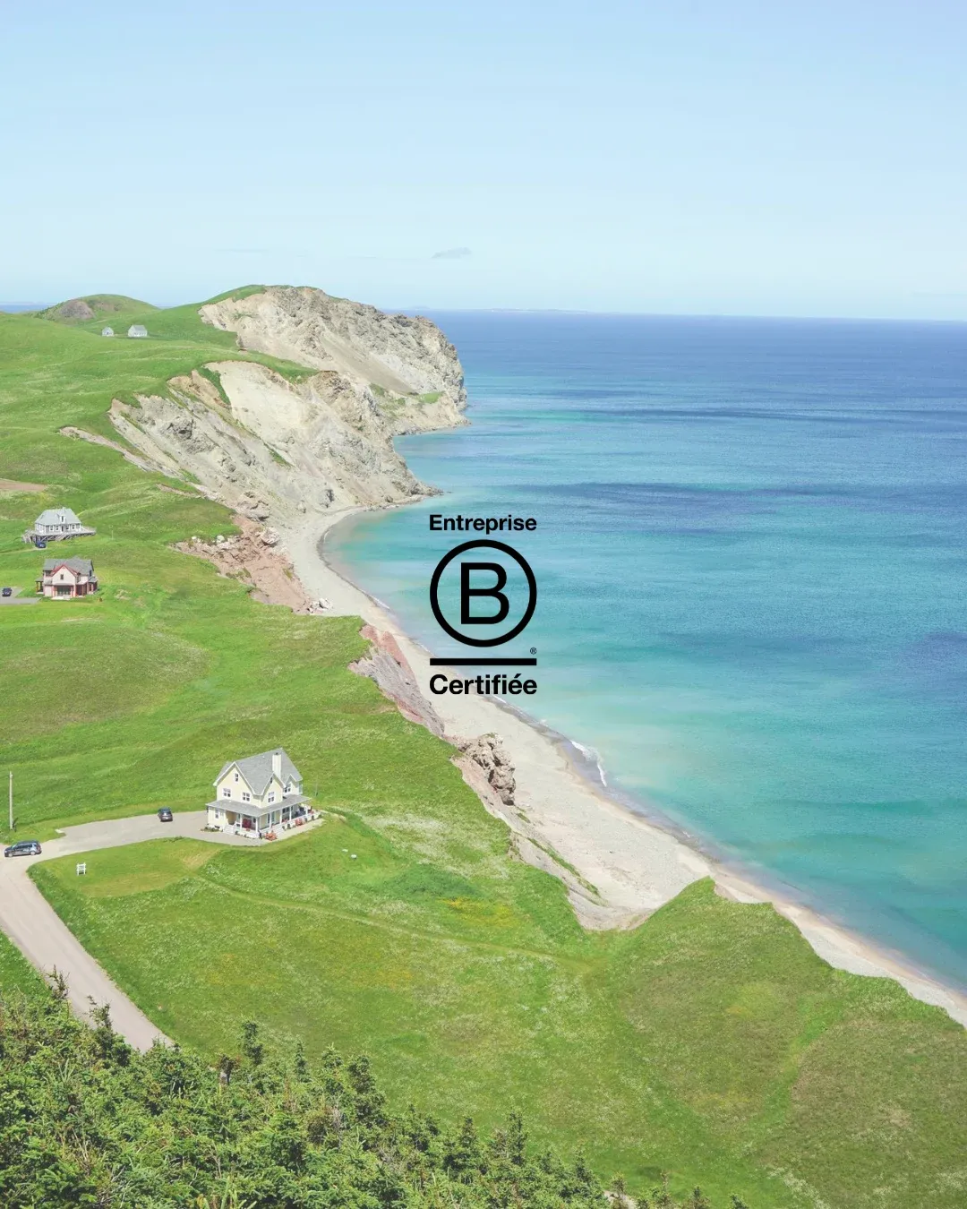 Aerial view of the Magdalen Islands coastline with Agence Nomade's Certified B Corporation seal